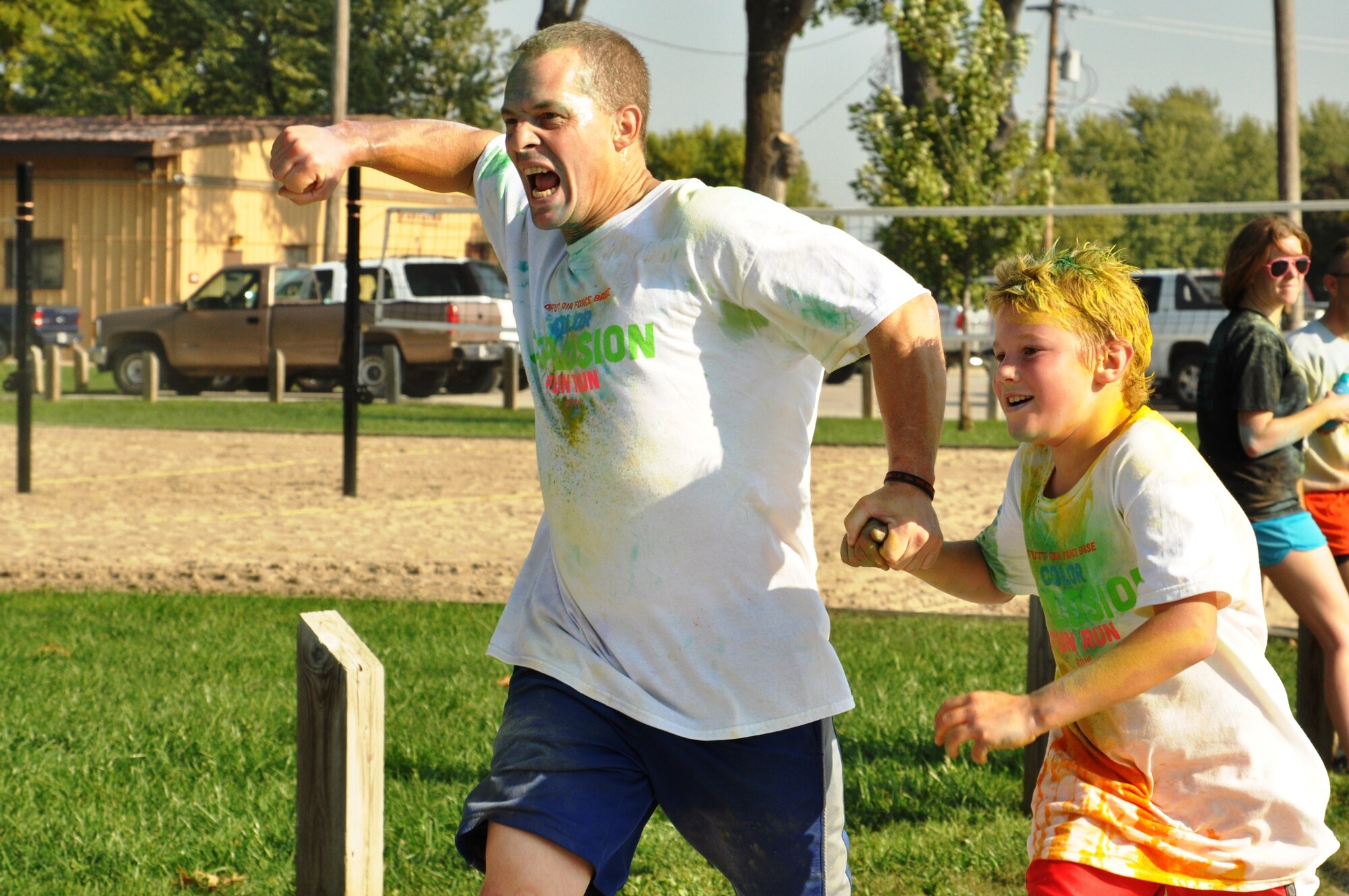 Members of Team Offutt participate in the Color Explosion Fun Run Sept. 27 at the Base Lake.  The run took more than three months of planning and more than 500 people signed-up. (U.S. Air Force photo by Staff Sgt. Rachelle Blake)