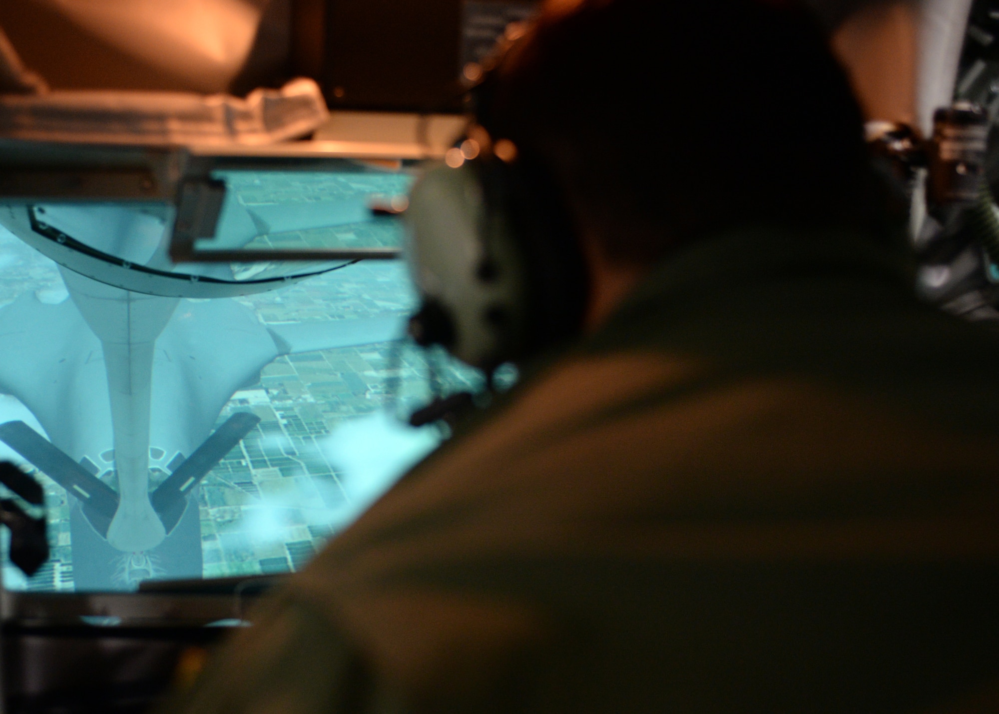 ALTUS AIR FORCE BASE, Okla. – U.S. Air Force Airman 1st Class Greg Adams, 97th Training Squadron student, refuels a B-1 Lancer bomber aircraft in the Boom Operator Weapons System Trainer at the KC-135 Stratotanker aircrew training center, Sept. 22, 2014. Altus AFB hosts two Boom Operator Weapon System Trainers in its KC-135 aircrew training facility. The BOWST is an inflight refueling training simulator that helps students become proficient in operating in a boom pod before they step into an actual refueling aircraft. (U.S. Air Force photo by Senior Airman Franklin R. Ramos/Released)