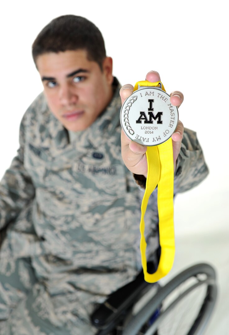 Staff Sgt. Mark Johnson,59th Medical Support Squadron systems administrator holds up his silver medal earned at the Invectus Game as a member of the United States Armed Forces National Team.(U.S. Air Force photo by Joshua Rodriguez/Released)