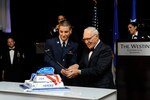 Airman Elijah Grenier, 502nd Communications Squadron, and retired Lt. Col. Ramon Horinek, former Vietnam War prisoner of war, cut the cake during the Joint Base San Antonio celebration of the Air Force's 67th birthday Saturday at the Westin Hotel in San Antonio.
(U.S. Air Force photos by Desiree Palacios)
