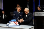 Airman Elijah Grenier, 502nd Communications Squadron, and retired Lt. Col. Ramon Horinek, former Vietnam War prisoner of war, cut the cake during the Joint Base San Antonio celebration of the Air Force's 67th birthday Saturday at the Westin Hotel in San Antonio.
(U.S. Air Force photos by Desiree Palacios)
