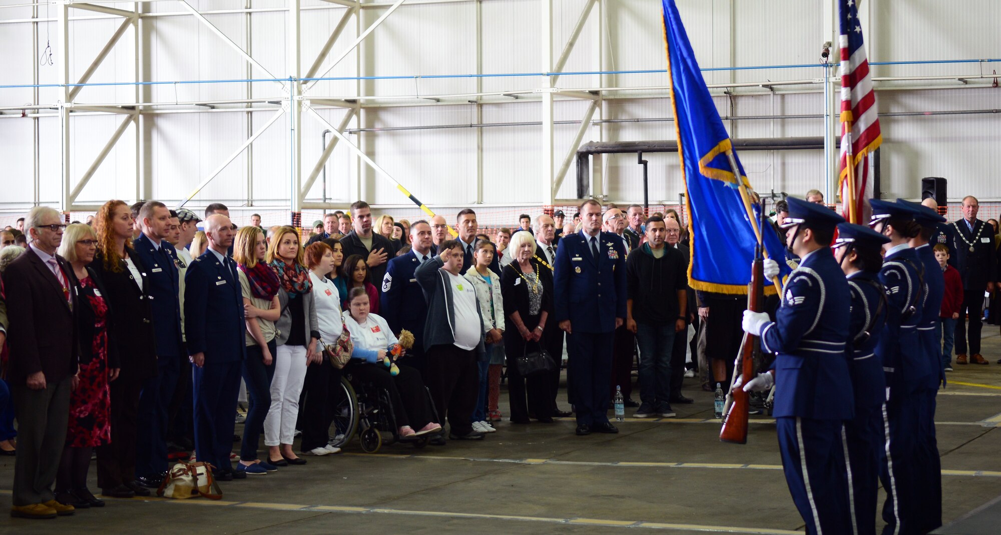 Team Mildenhall Honor Guard members present the colors prior to the start of the  Joan Mann Special Sports Day event Sept. 27, 2014, on RAF Mildenhall, England. (U.S. Air Force photo/Airman 1st Class Jonathan Light/Released)