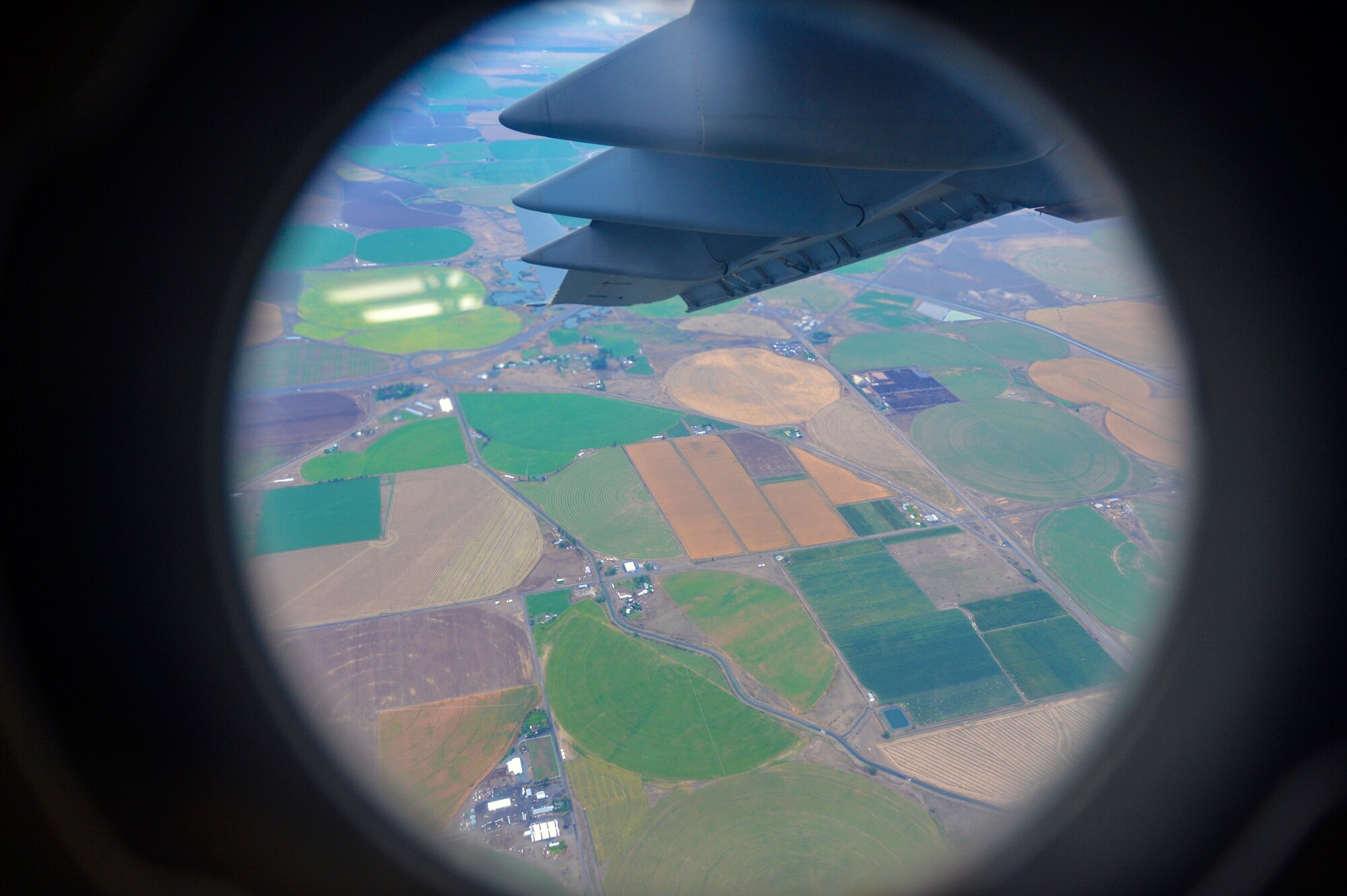 After the loadmasters released dropsonde ultra-high frequency receivers, the C-17 Globemaster III banks left to circle back toward the Hester drop zone September 25, 2014, during a training mission near Yakima, Wash. After in-flight refueling training, the McChord aircrew dropped six dropsonde UHF’s and three joint air precision airdrop system bundles before practicing assault landings at Moses Lake, Wash. (U.S. Air Force photo/Staff Sgt. Russ Jackson)
