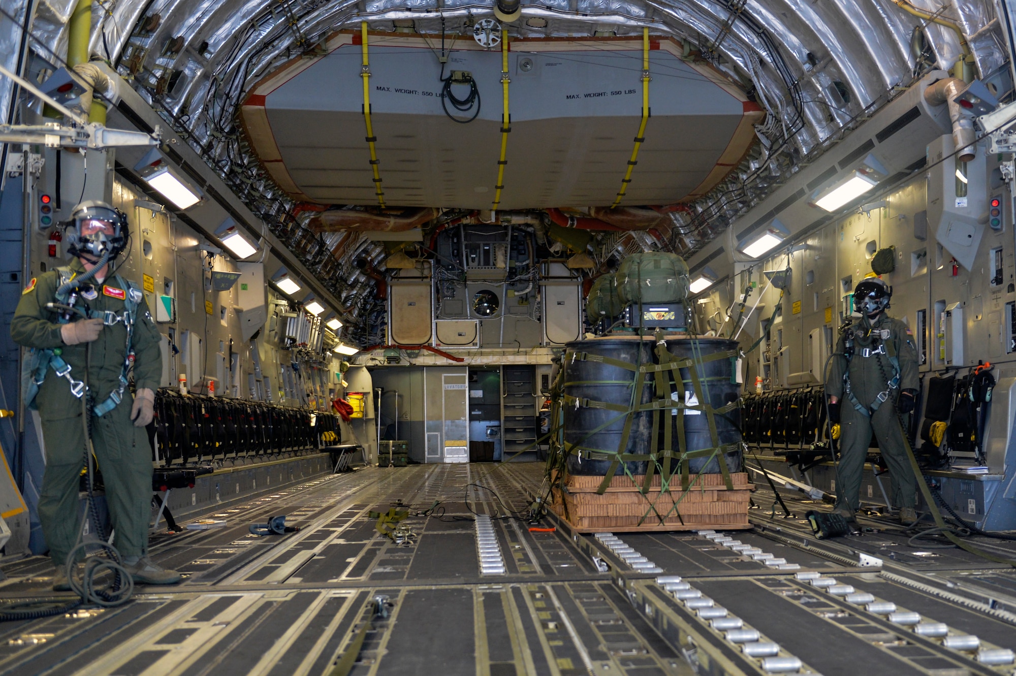 Tech. Sgt. James Chestnut (left), 10th Airlift Squadron loadmaster, and Tech. Sgt. Doug Hollingsworth, 8th AS loadmaster, watch the aft door of a C-17 Globemaster III aircraft open September 25, 2014, as they prepare to drop a joint precision airdrop system during a training mission near Joint Base Lewis-McChord, Wash. Troops on the ground favor the JPADS employment because they can utilize nontraditional drop zones that are small, easier to protect and in their immediate vicinity due to the accuracy of the payloads. (U.S. Air Force photo/Staff Sgt. Russ Jackson) 