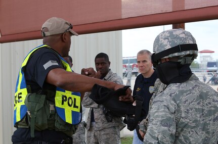 Tech. Sgt. William Graham, 902nd Security Forces Squadron flight chief, provides a safety brief prior to the start of the force-on-force challenge portion of the Battle of the Badges competition Sept. 27 at Joint Base San Antonio-Randolph’s Camp Talon. Firefighters and security forces members from Joint Base San Antonio locations have competed in Battle of the Badges for the past three years. The initiative was designed to build stronger bonds between the agencies and has become a tradition for the unit members, their families and friends. (U.S. Air Force photo by Johnny Saldivar)