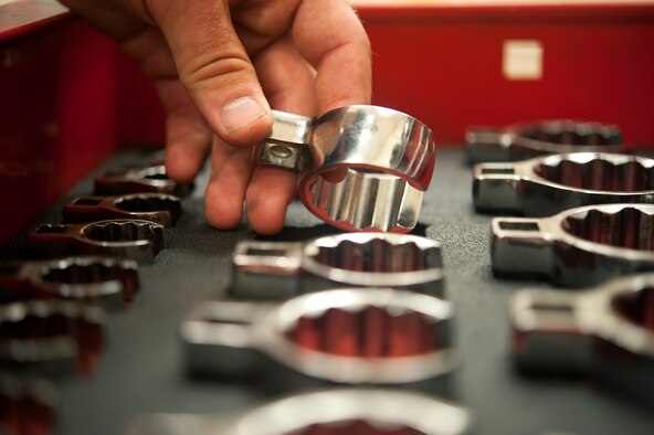 U.S. Air Force Senior Airman Dillon Gross, 67th Aircraft Maintenance Unit F-15 Eagle crew chief, inspects his tools before beginning maintenance on a jet on Kadena Air Base, Japan, Sept. 16, 2014. Sept. 29, 2014, marks the 35th anniversary of the F-15Cs arrival to Kadena. With a perfect record of more than 100 confirmed kills and no combat losses in operations and contingencies ranging from Turkey and Bosnia to Iraq and Afghanistan, the Eagle has proven itself time and again. (U.S. Air Force photo by Senior Airman Maeson L. Elleman/Released)