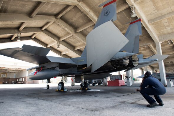 A U.S. Air Force F-15 Eagle crew chief from the 67th Aircraft Maintenance Unit watches pre-flight procedures and communicates with the aircraft's pilot before takeoff on Kadena Air Base, Japan, Sept. 16, 2014. Sept. 29, 2014, marks the 35th anniversary of the F-15C's arrival to Kadena. With a perfect record of more than 100 confirmed kills and no combat losses in operations and contingencies ranging from Turkey and Bosnia to Iraq and Afghanistan, the Eagle has proven itself time and again. (U.S. Air Force photo by Senior Airman Maeson L. Elleman/Released)