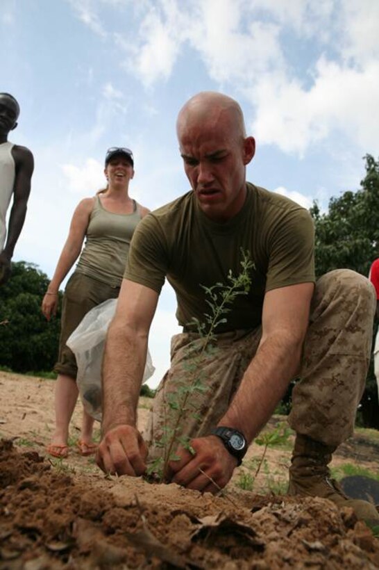 Cpl. David Wyble, a civil affairs Marine with 11th Marine Regiment, plants a tree as part of a live fence for a local farmer here, July 17. The volunteer project was part of a civil affairs humanitarian outreach into the community during Exercise Western Accord 2012. U.S. service members, primarily Reservists from the Marines, Army, Navy, and Air Force are taking part in WA-12 -- a multi-lateral exercise with Senegalese and several Western African nations. The training exercise runs from June 26 – July 24 and involves Armed Forces of Senegal, Burkina Faso, Guinea, Gambia and France. (USMC photo by Lance Cpl. Jessica DeRose)
