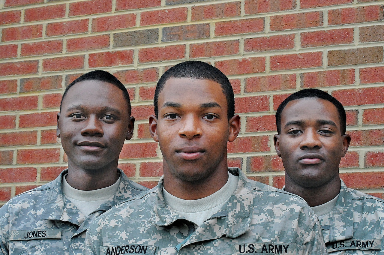 Pfc. Derek Jones, Pvt. Joshua Anderson and Pfc. DeAndre Kinlaw, all now 19 years old, graduated from the Army’s Food Service Specialist Course on Sept. 10, 2014. The Jacksonville, Fla., natives have attended middle school, high school and college together and are now embarking on a stint with the Florida National Guard. U.S. Army photo by Terrance Bell