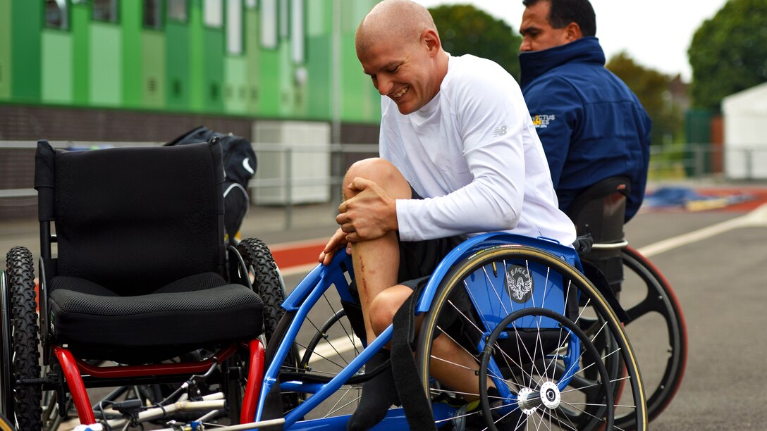 U.S. Marine Corps Staff Sergeant Jacob Rich prepares to practice for the 100m Men's Wheel event for the 2014 Invictus Games at Mayesbrooks Training Center in London, Sept. 10, 2014. The Invictus Games is an opportunity for wounded, ill, and injured service members from around the world to recover and rehabilitate through competing in adaptive sports.