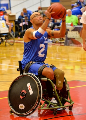 Master Sgt. Christopher Aguilera warms up before his game against the Navy in the first wheelchair basketball game of the 2014 Warrior Games Sept. 29, 2014, at the United States Olympic Training Center in Colorado Springs, Colo. The Air Force team lost 38-19 and will play Special Operations in the next round. (U.S Air Force photo/Staff Sgt. Devon Suits) 