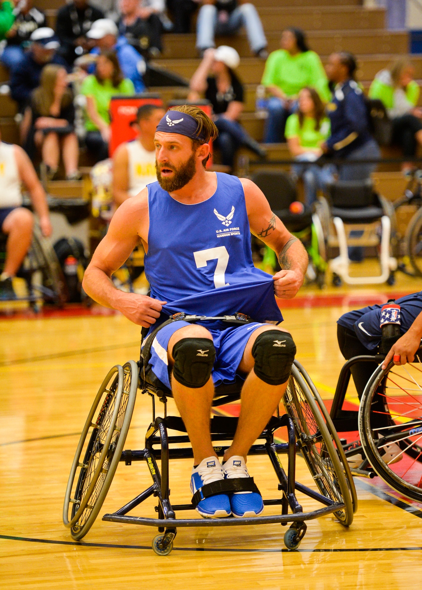 Retired Senior Airman Ryan Gallo adjusts his uniform after being knocked down in a basketball game against the Navy at the 2014 Warrior Games on Sept. 29, 2014, at the United States Olympic Training Center in Colorado Springs, Colo. The Air Force team lost 38-19 and will play Special Operations in the next round. (U.S Air Force photo/Staff Sgt. Devon Suits) 
