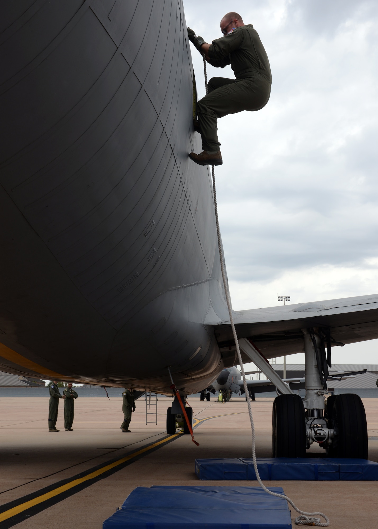 A student with the 97th Training Squadron climbs down from a 54th Air Refueling Squadron KC-135 Stratotanker refueling aircraft Sept. 24, 2014, at Altus Air Force Base, Okla. Instructors from the 54th ARS taught the students how to safely evacuate the aircraft in an emergency situation. (U.S. Air Force photo/Senior Airman Franklin R. Ramos)