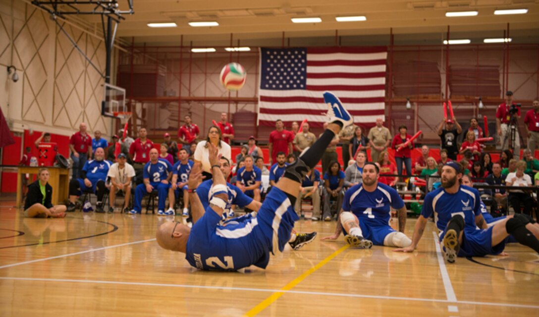 Air Force volleyball team player Christopher Aguilera returns a serve from the Marine Corps team to his teammates at the Warrior Games Sept. 29, 2014, in Colorado Springs, Colo. The Airmen gave the Marines a run for their money as both teams had to struggle for every point. (U.S. Marine Corps photo/Cpl. Cuong Le)