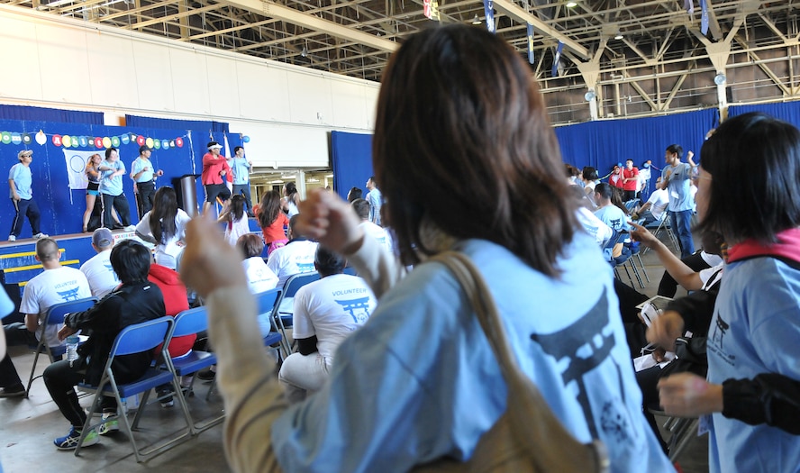A Special Olympic Athlete Zumba dances during the 28th Annual Special Olympics at Misawa Air Base, Japan, Sept. 27, 2014. Special Olympians and volunteers had an opportunity to enjoy a quick class of Zumba as part of the evening entertainment. (U.S. Air Force photo by Senior Airman Jose L. Hernandez-Domitilo)