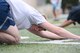 An Airman stretches after a morning session of the Warrior Run Program at Yokota Air Base, Japan, 2014. The program is part of the Healthy Base Initiative held semiannually at Yokota to assist service members in improving their physical fitness scores or to improve their overall health and wellness. (U.S. Air Force photo by Staff Sgt. Cody H. Ramirez/Released)