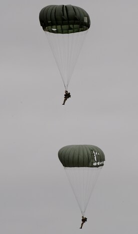 Members of the Liberty Jump Team perform during the California International Air Show in Salinas, Calif., Sept. 28, 2014. The team utilizes static-line parachutes and a C-47 to pay tribute to the D-Day invasion of Western Europe during World War II. (U.S. Air Force photo by Staff Sgt. Robert M. Trujillo/Released)