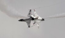 Two Thunderbirds perform opposing turns during the California International Air Show in Salinas, Calif., Sept. 28, 2014. The U.S Air Force Aerial Demonstration Team has utilized the F-16 fighter aircraft since 1982. (U.S. Air Force photo by Staff Sgt. Robert M. Trujillo/Released)