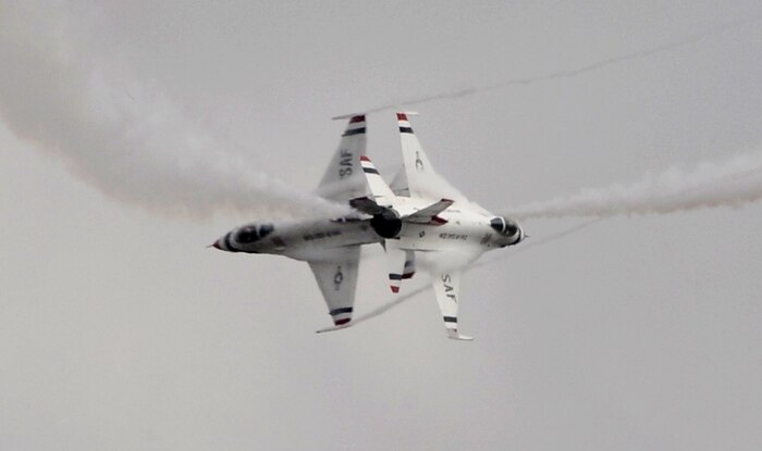 Two Thunderbirds perform opposing turns during the California International Air Show in Salinas, Calif., Sept. 28, 2014. The U.S Air Force Aerial Demonstration Team has utilized the F-16 fighter aircraft since 1982. (U.S. Air Force photo by Staff Sgt. Robert M. Trujillo/Released)