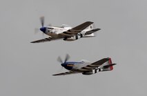 Two vintage P-51 Mustangs perform a fly-by during the California International Air Show in Salinas, Calif., Sept. 28, 2014. The Mustang has a top speed of more than 400 mph. (U.S. Air Force photo by Staff Sgt. Robert M. Trujillo/Released)