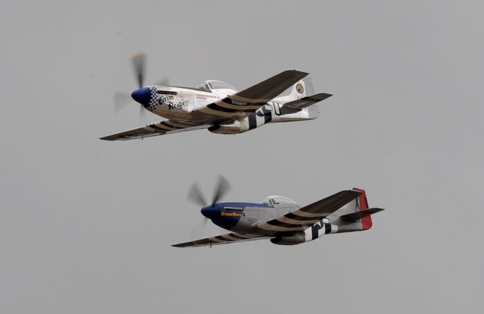 Two vintage P-51 Mustangs perform a fly-by during the California International Air Show in Salinas, Calif., Sept. 28, 2014. The Mustang has a top speed of more than 400 mph. (U.S. Air Force photo by Staff Sgt. Robert M. Trujillo/Released)