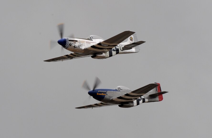 Two vintage P-51 Mustangs perform a fly-by during the California International Air Show in Salinas, Calif., Sept. 28, 2014. The Mustang has a top speed of more than 400 mph. (U.S. Air Force photo by Staff Sgt. Robert M. Trujillo/Released)