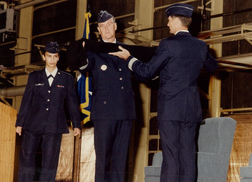 Lt Gen Richard B. Meyers, U.S. Forces Japan and 5th Air Force Commander, and Brig Gen George W. Norwood, 35th Fighter Wing Commander, uncase the 35th Fighter Wing flag during the unit activation ceremony at Misawa, Japan on October 3, 1994.  The 35th Fighter Wing officially activated on October 1, 1994.  (U.S. Air Force Photo)