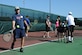 Thanking the Troops through Tennis attendees practice their forehand at the West Fitness Center, Sept. 30, 2014. The clinic taught tennis fundamentals to Joint Base Andrews families. (U.S. Air Force photo by Airman 1st Class J.D. Maidens/ released)