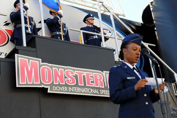 Capt. Raecita High, 436th Airlift Wing chaplain, provides the invocation prior to the start of the NASCAR Nationwide Series Race Sept. 27, 2014 at the Dover International Speedway in Dover, Del. Dover Air Force Base Honor Guard members presented the colors during the singing of the national anthem. (U.S. Air Force photo/Staff Sgt. Elizabeth Morris)