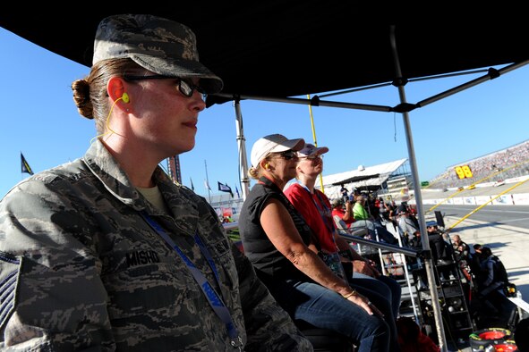 Master Sgt. Breah Misho, 436th Operations Support Squadron first sergeant, watches the NASCAR Nationwide Series Race Sept. 27, 2014 at the Dover International Speedway in Dover, Del. Misho served as an honorary pit crew member for Blake Koch, driver of the no. 10 car, and was able to spend time with his pit crew and watch the race from his pit box. (U.S. Air Force photo/Staff Sgt. Elizabeth Morris)