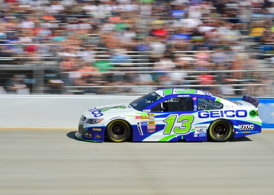 Casey Mears, driver of the #13 GEICO Chevy SS, races down the straightaway going into turn one of the Monster Mile during the 2014 AAA 400, NASCAR Sprint Cup Series race Sept. 28, 2014, at the Dover International Speedway in Dover, Del. The Dover tailflash was applied as a decal on the both lower quarter panels and decklid of the car. (U.S. Air Force photo/Airman 1st Class William Johnson)