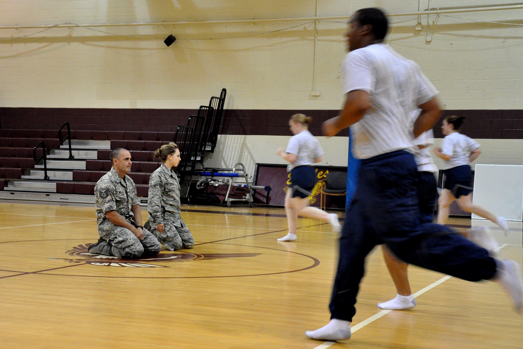 Tech. Sgt. Tim Kelly and Airman 1st Class Rachel Patterson, 916th Force Support Squadron services specialists, provide physical training assistance to 916th Air Refueling Wing Airmen, Seymour Johnson Air Force Base, North Carolina. In addition to their military service, Kelly and Patterson are accredited, certified personal trainers and work full-time in the fitness industry. (Staff Sgt. Alan Abernethy) 