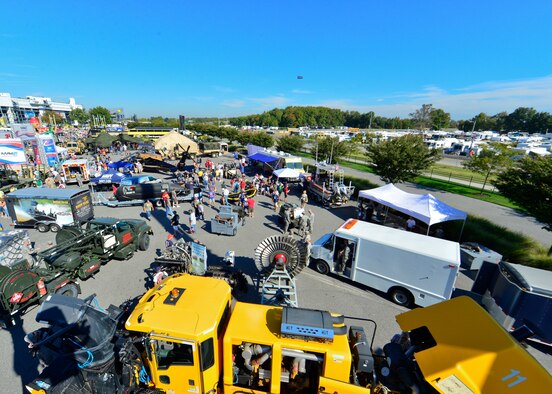 NASCAR fans tour The USO Military Village Sept. 28, 2014, at the Dover International Speedway in Dover, Del. The USO Military Village was 36,000 square feet and had exhibits, vehicles and table demonstrations from all five service branches. (U.S. Air Force photo/Airman 1st Class William Johnson)
