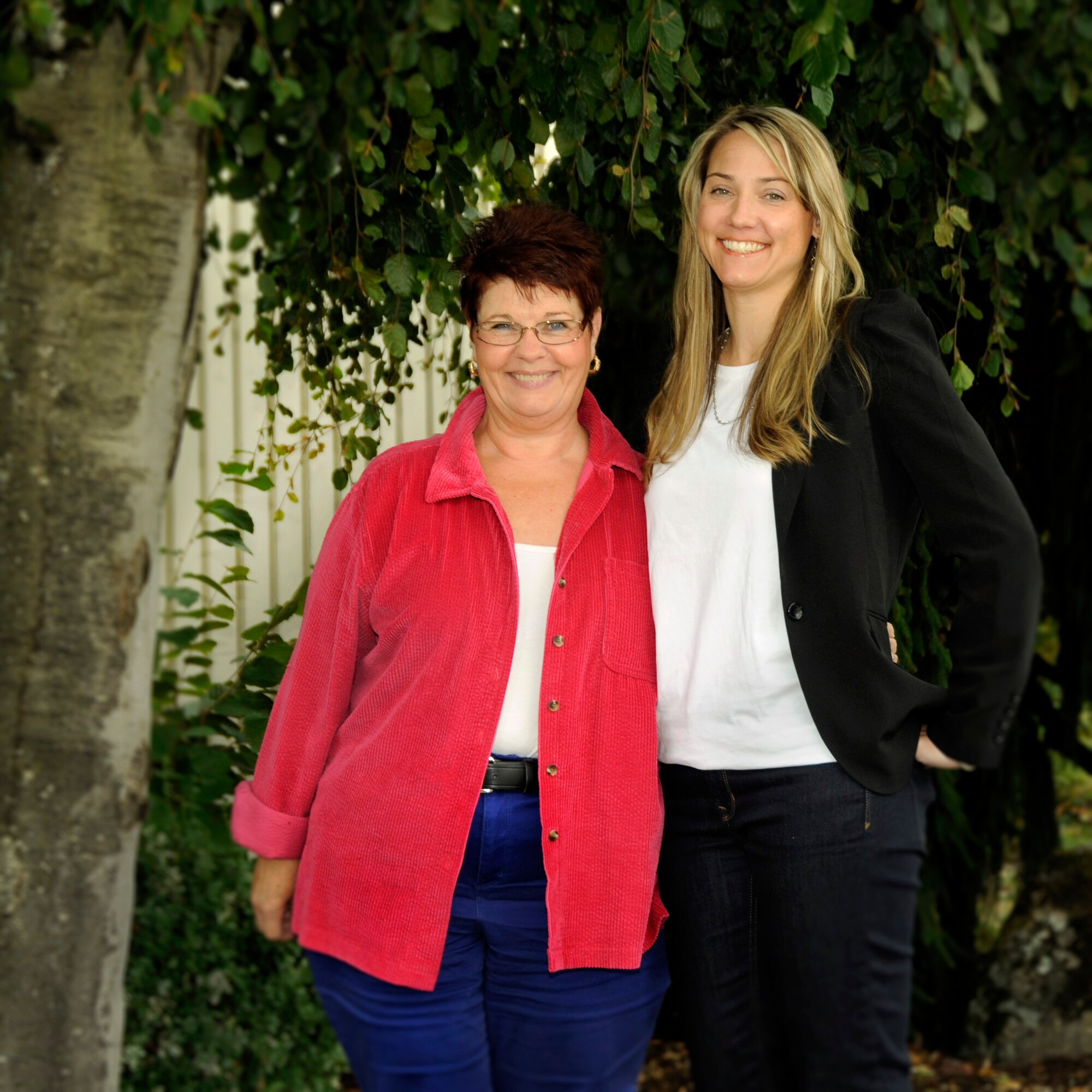 With the retirement of 142nd Fighter Wing Family Programs Director Mary Bell, left, her replacement Amy Conroy, right, stand together for a photograph at the Portland Air National Guard Base, Ore., Sept. 23, 2014. Bell has been the Family Programs Director for nearly 12 years and retires on Oct. 1, with Conroy taking her place full time. (U.S. Air National Guard photo by Tech. Sgt. John Hughel, 142nd Fighter Wing Public Affairs/Released)