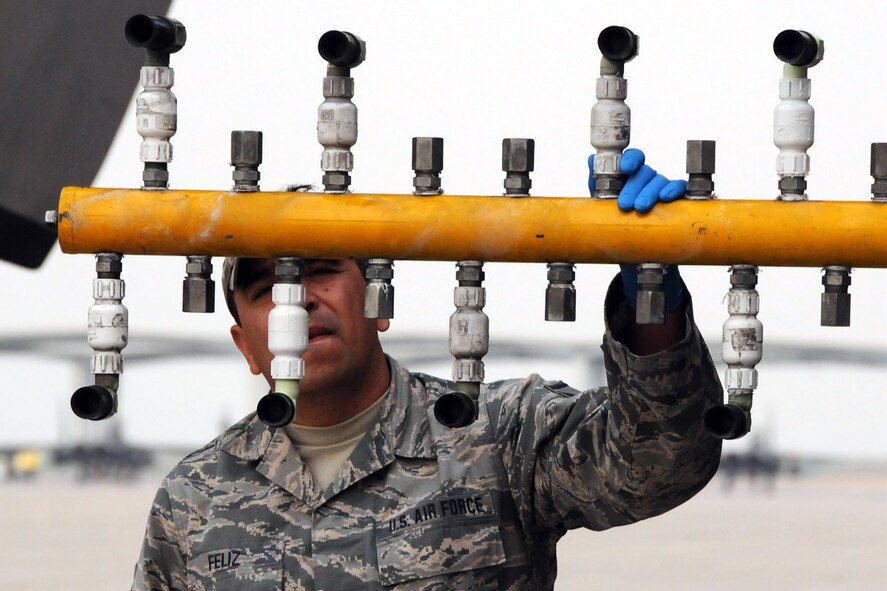 MOUNTAIN HOME AIR FORCE BASE, Idaho – Air Force Reserve Master Sgt.  Stephen Feliz, an aerial spray maintainer assigned to the 910th Maintenance Squadron, inspects the spray nozzles on a C-130 Hercules aircraft prior to its take off here, Sept. 18, 2014.  The aircraft performed a series of aerial spray sorties over the nearby Saylor Creek Bombing Range. The 910th Airlift Wing, based at Youngstown Air Reserve Station, Ohio, is home to the Department of Defense’s only large-area, fixed-wing aerial spray capability, conducted a mission to spray herbicide on invasive cheat grass as a means of fire prevention here, Sept. 15-26, 2014. U.S. Air Force photo by Tech. Sgt. Rick Lisum