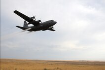 MOUNTAIN HOME AIR FORCE BASE, Idaho – An Air Force Reserve C-130 Hercules aircraft, assigned to the 910th Airlift Wing, flies over nearby Saylor Creek Bombing Range here, Sept. 17, 2014, spraying herbicide to control the cheat grass in the area. Cheat grass has become a hazard in the area by destroying the native vegetation and increasing the likelihood of fires spreading rapidly. The 910th Airlift Wing, based at Youngstown Air Reserve Station, Ohio, is home to the Department of Defense’s only large-area, fixed-wing aerial spray capability, conducted a mission to spray herbicide on invasive cheat grass as a means of fire prevention here, Sept. 15-26, 2014. U.S. Air Force photo by Senior Airman Rachel Kocin