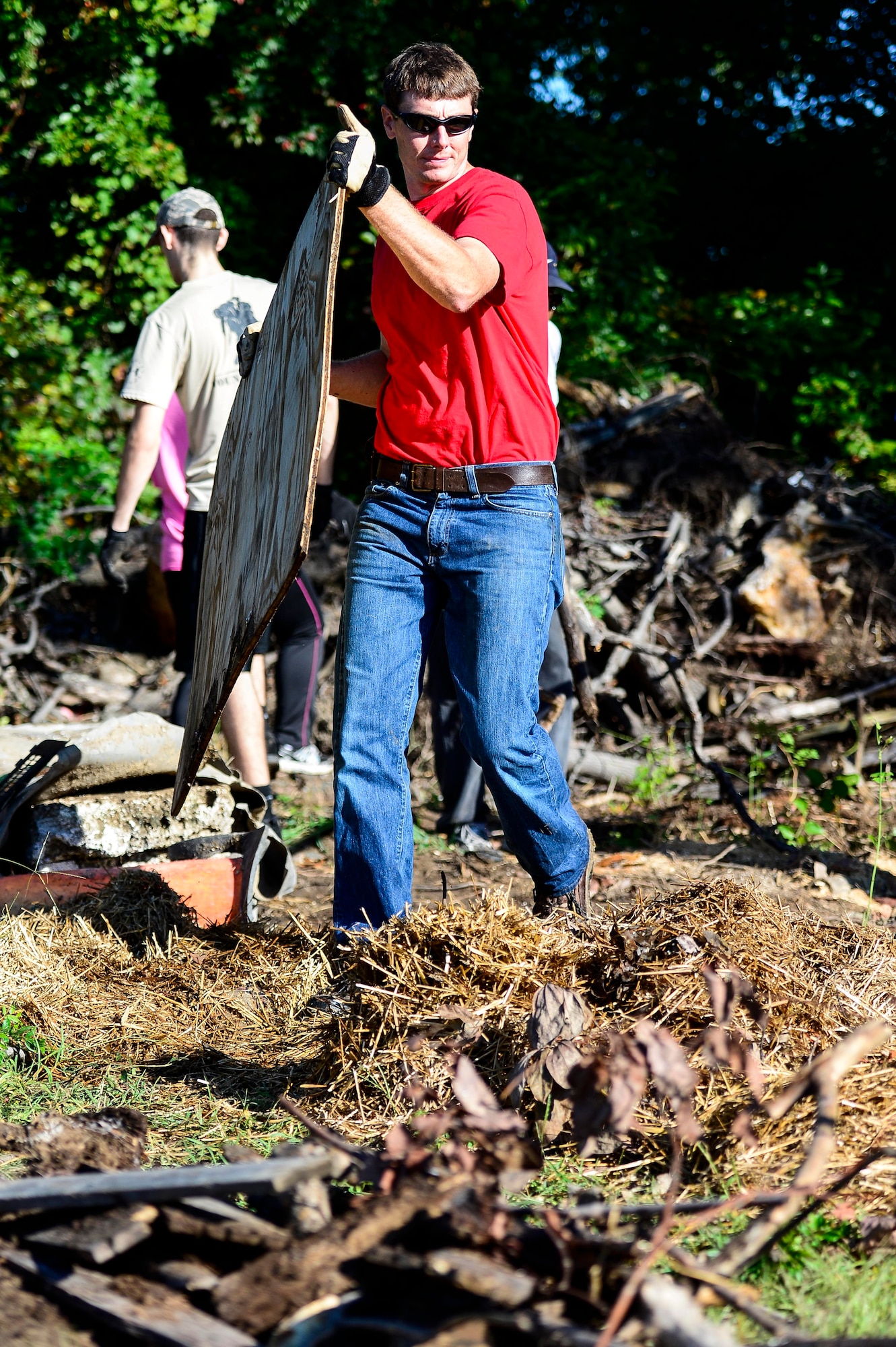 Thomas Olexa, 633rd Civil Engineer Squadron natural resource manager, clears debris as part of a restoration project at Bethel Park and Family Campground in Hampton, Va., Sept. 27, 2014. The 633rd CES recently won a National Public Lands Day Legacy Award, which included $6,212 to restore the public park. (U.S. Air Force photo by Senior Airman Kayla Newman/Released) 