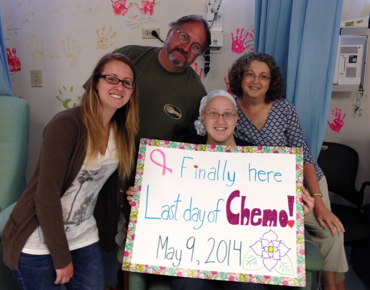 Staff Sgt. Amanda Dick celebrates her last chemotherapy treatment with her family, May 9, 2014, at Tripler Army Medical Center, Hawaii. According to the American Cancer Society, about one in eight women in the U.S. are diagnosed with breast cancer in their lifetime. (Courtesy photo)