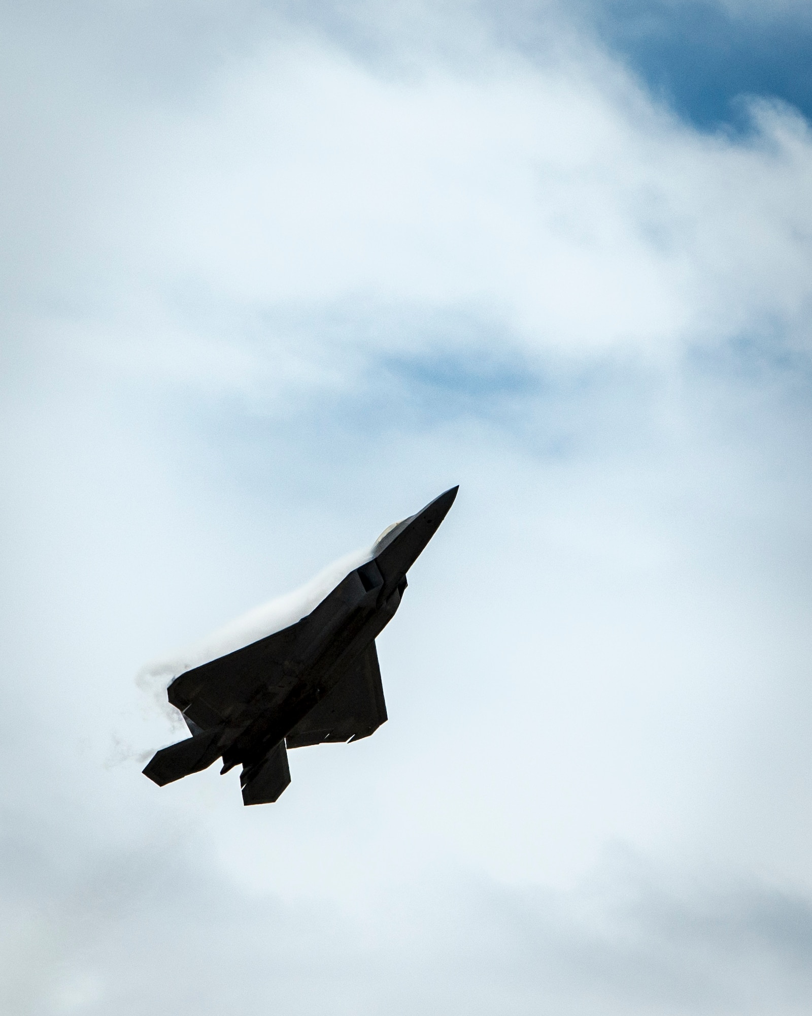 An F-22 Raptor demonstrates its maneuverability during the Wings over the Pacific Air Show at Joint Base Pearl Harbor-Hickam, Hawaii, Sept. 28, 2014. The Raptor’s sophisticated aerodesign, advanced flight controls, thrust vectoring, and high thrust-to-weight ratio provide the capability to outmaneuver all current and projected aircraft. (U.S. Air Force photo by Capt. Raymond Geoffroy/Released)