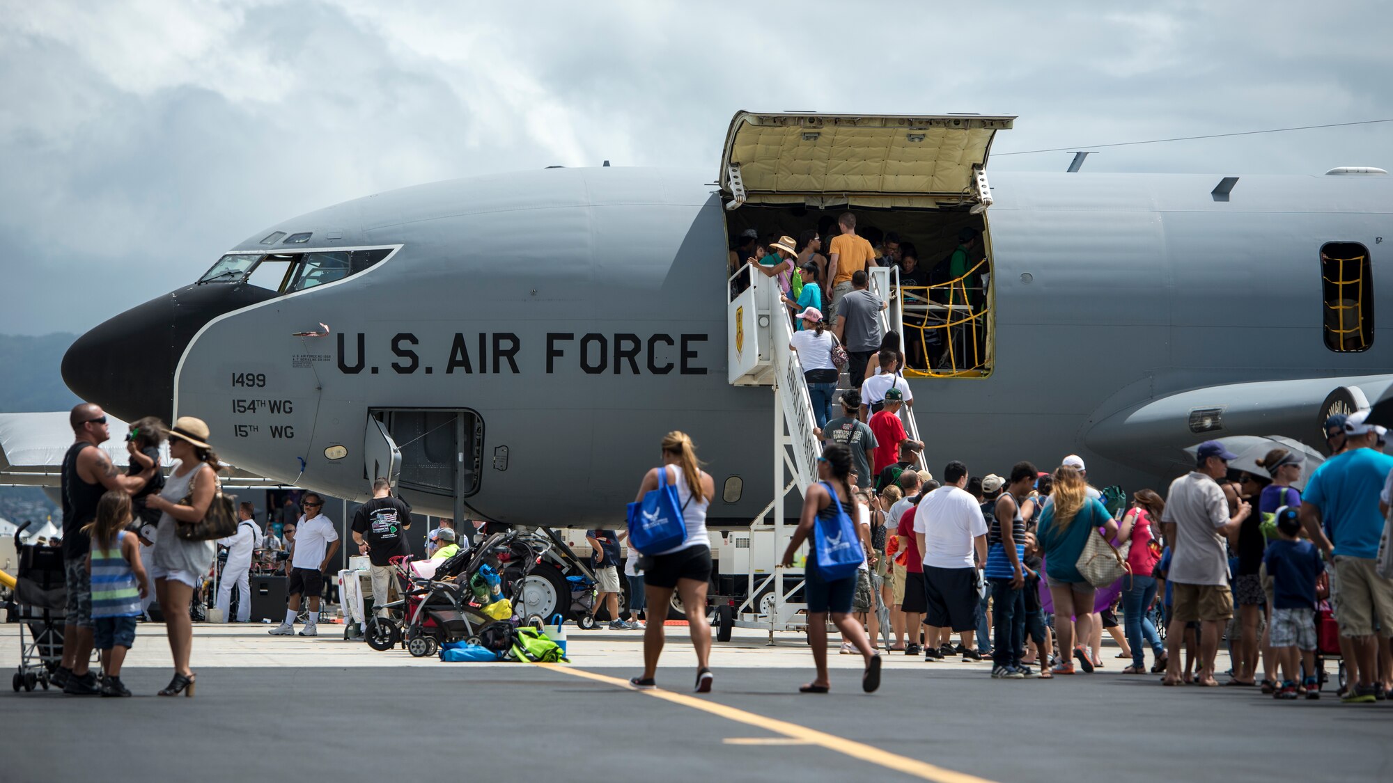Guests line up to board a KC-135 Stratotanker during the Wings over the Pacific Air Show at Joint Base Pearl Harbor-Hickam, Hawaii, Sept. 28, 2014. The Stratotanker provides the core aerial refueling capability for the United States Air Force and has excelled in this role for more than 50 years. (U.S. Air Force photo by Capt. Raymond Geoffroy/Released)