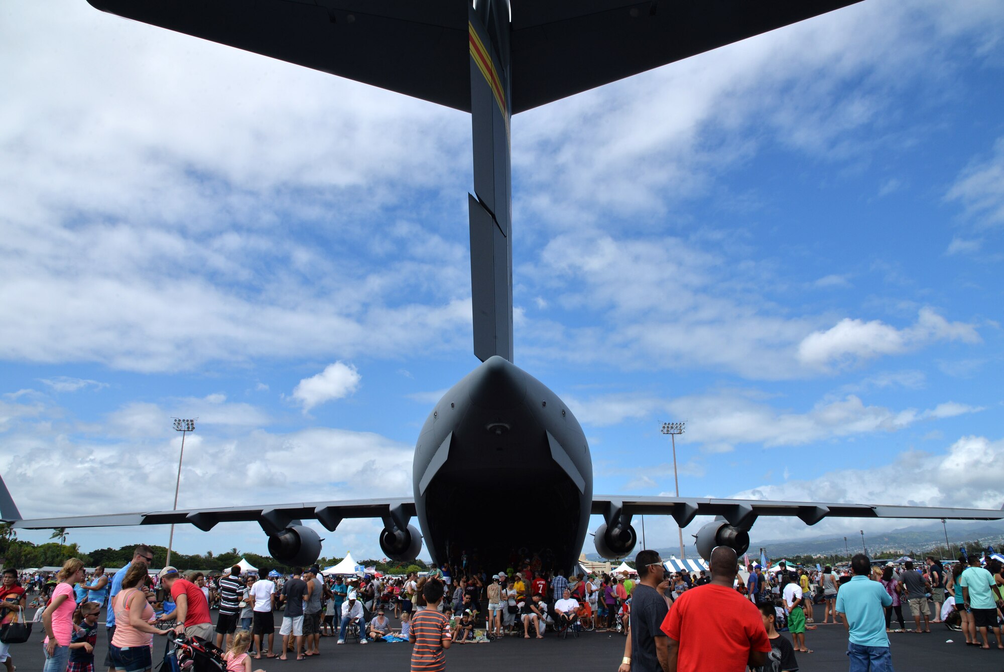Attendees of the Wings Over the Pacific Air Show explore a C-17 Globemaster III at Joint Base Pearl Harbor-Hickam, Hawaii, Sept. 27, 2014. Inside the aircraft, air crew members were present to answer any questions. Thousands of spectators witnessed aerial performances by demonstration teams including the F-22 Raptor Aerial Demonstration Team and the Navy Blue Angels. (U.S. Air Force photo by Staff Sgt. Alexander Martinez/Released)  
