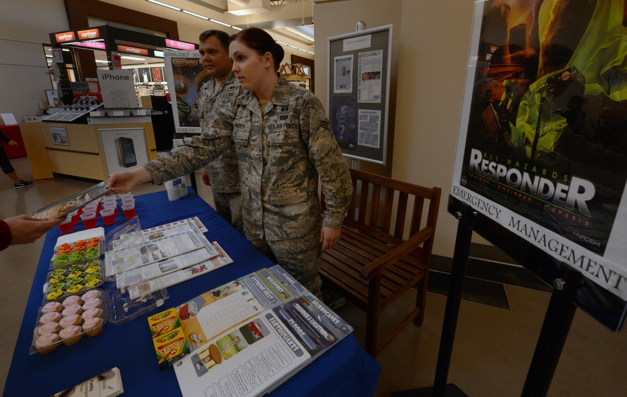U.S. Air Force Senior Airman Lauren Yancey, 20th Civil Engineer Squadron emergency management journeyman, hands out a pamphlet with information regarding preparing for a disaster, Sept. 25, 2014 at Shaw Air Force Base, S.C. The month of September is designated as National Preparedness Month, started by the Federal Emergency Management Agency and the Department of Homeland Security in 2002 after the September 11, 2001, attacks. The program is designed to educate and empower Americans to be safe during all types of emergencies. (U.S. Air Force photo by Senior Airman Tabatha Zarrella/Released)