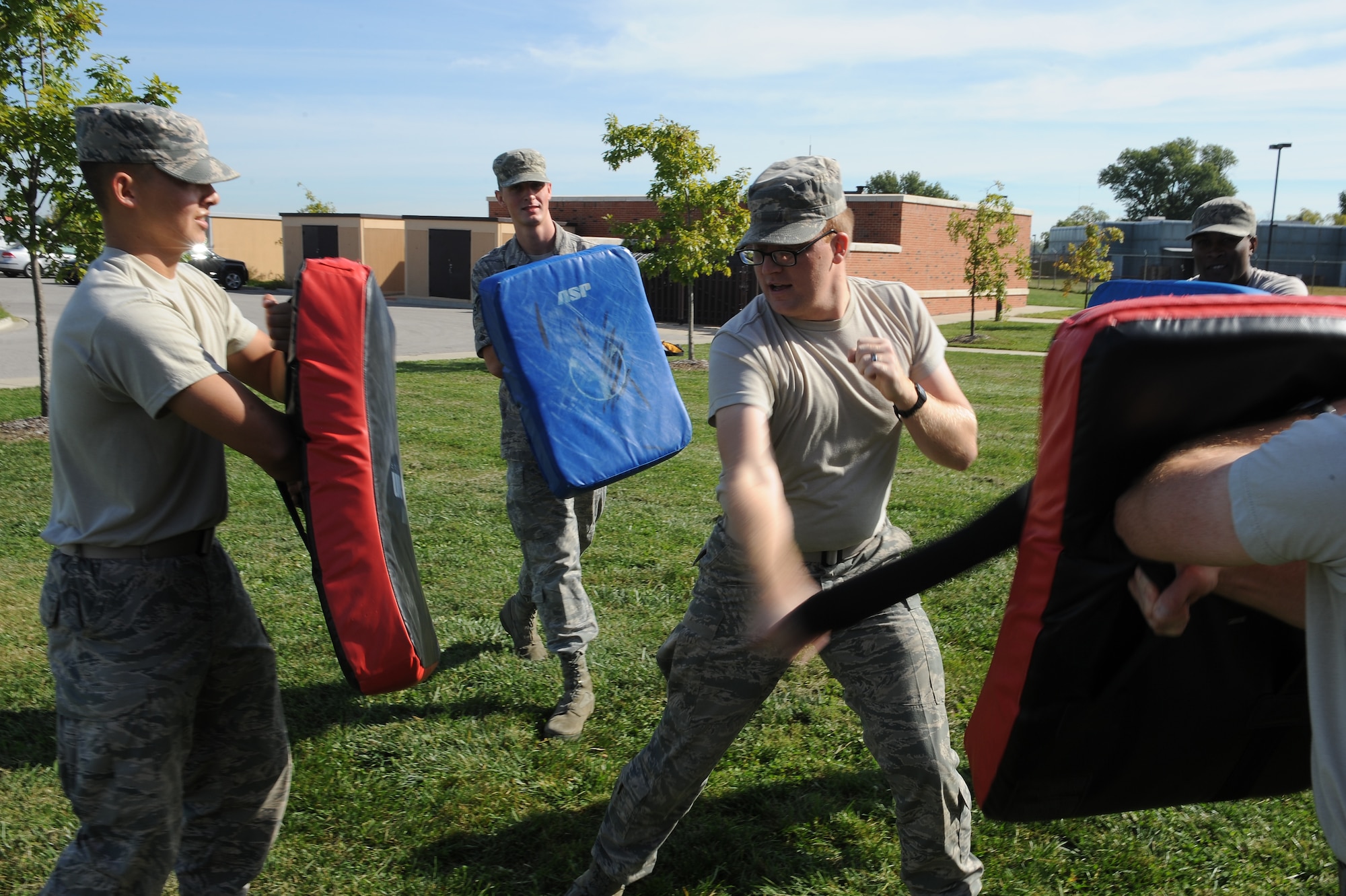 Airman 1st Class Joseph Wood, 375th Communications Support Squadron, defends himself during a simulated attack Sept. 24, 2014 at Scott Air Force Base, Ill. Wood is one of a number of augmentees for the 375th Security Forces Squadron, who are assisting the squadron due to low manning. (U.S. Air Force photo/Staff Sgt. Jonathan Fowler)