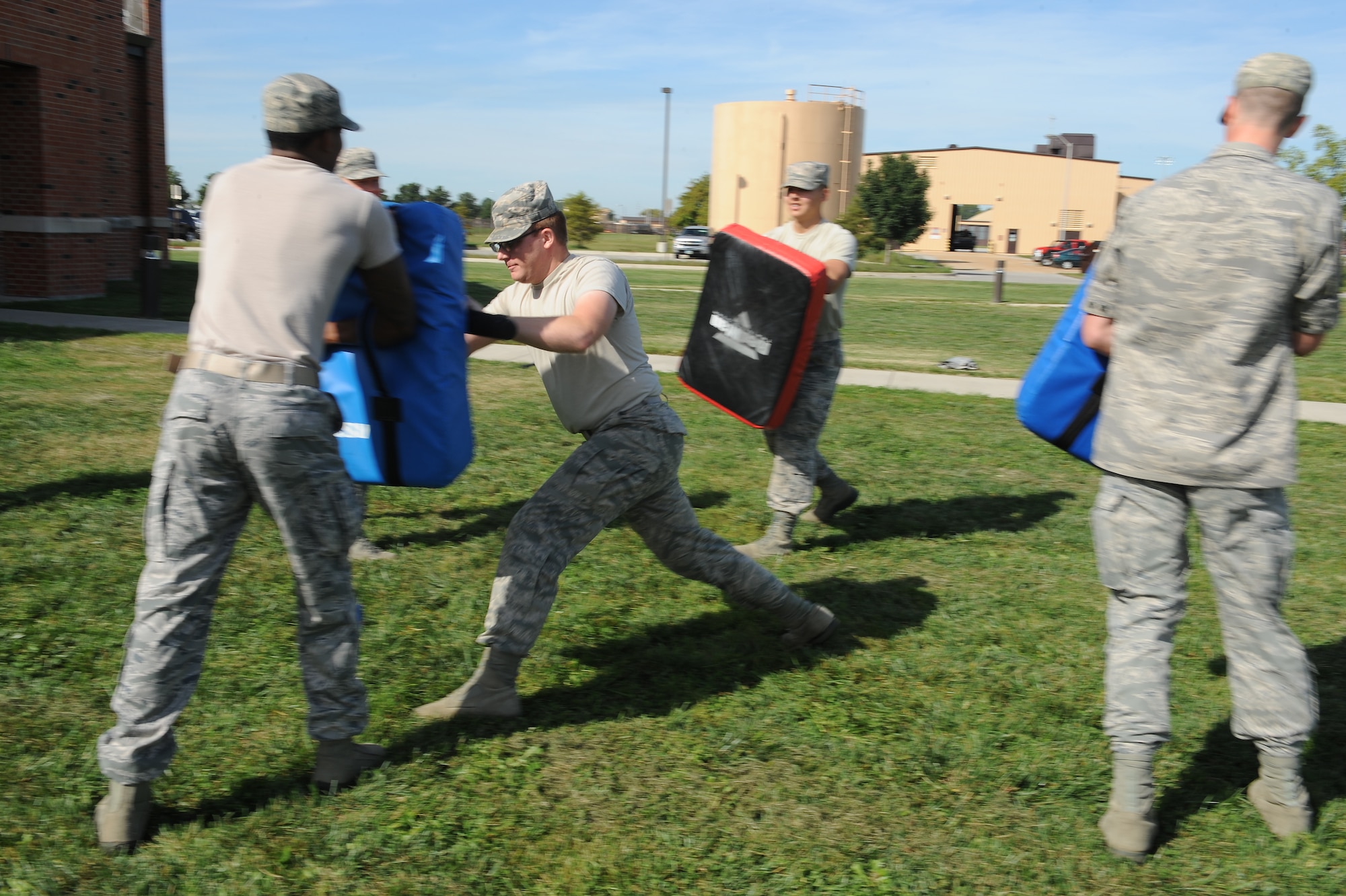 Airman 1st Class Joseph Wood, 375th Communications Support Squadron, defends himself during a simulated attack Sept. 24, 2014 at Scott Air Force Base, Ill. Wood is one of a number of augmentees for the 375th Security Forces Squadron, who are assisting the squadron due to low manning. (U.S. Air Force photo/Staff Sgt. Jonathan Fowler)