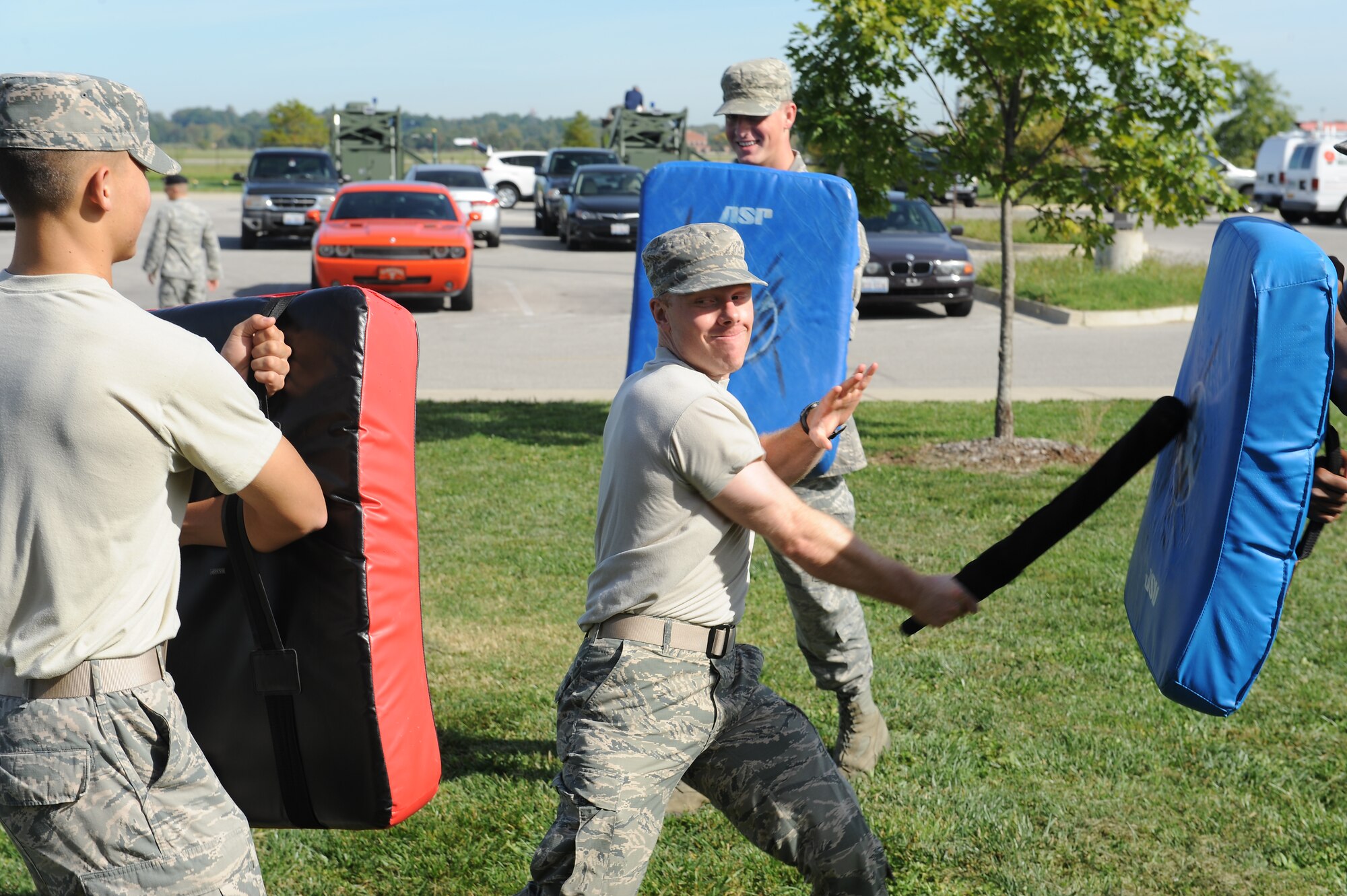 Airman 1st Class James Lobban, 375th Medical Support Squadron, strikes at a pad during a training session Sept. 24, 2014 at Scott Air Force Base, Ill. The training taught augmentees for the 375th Security Forces Squadron how to properly use a baton, where they were allowed to strike and how to deal with multiple attackers. (U.S. Air Force photo/Staff Sgt. Jonathan Fowler)