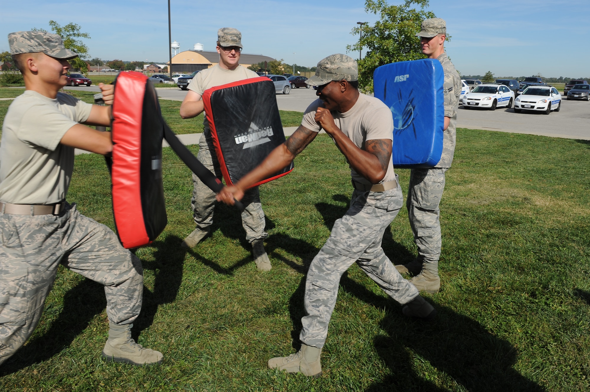 Senior Airman Joseph Washington, 375th Communications Support Squadron, strikes at a pad during a training session Sept. 24, 2014 at Scott Air Force Base, Ill. The training taught augmentees for the 375th Security Forces Squadron how to properly use a baton, where they were allowed to strike and how to deal with multiple attackers. (U.S. Air Force photo/Staff Sgt. Jonathan Fowler)
