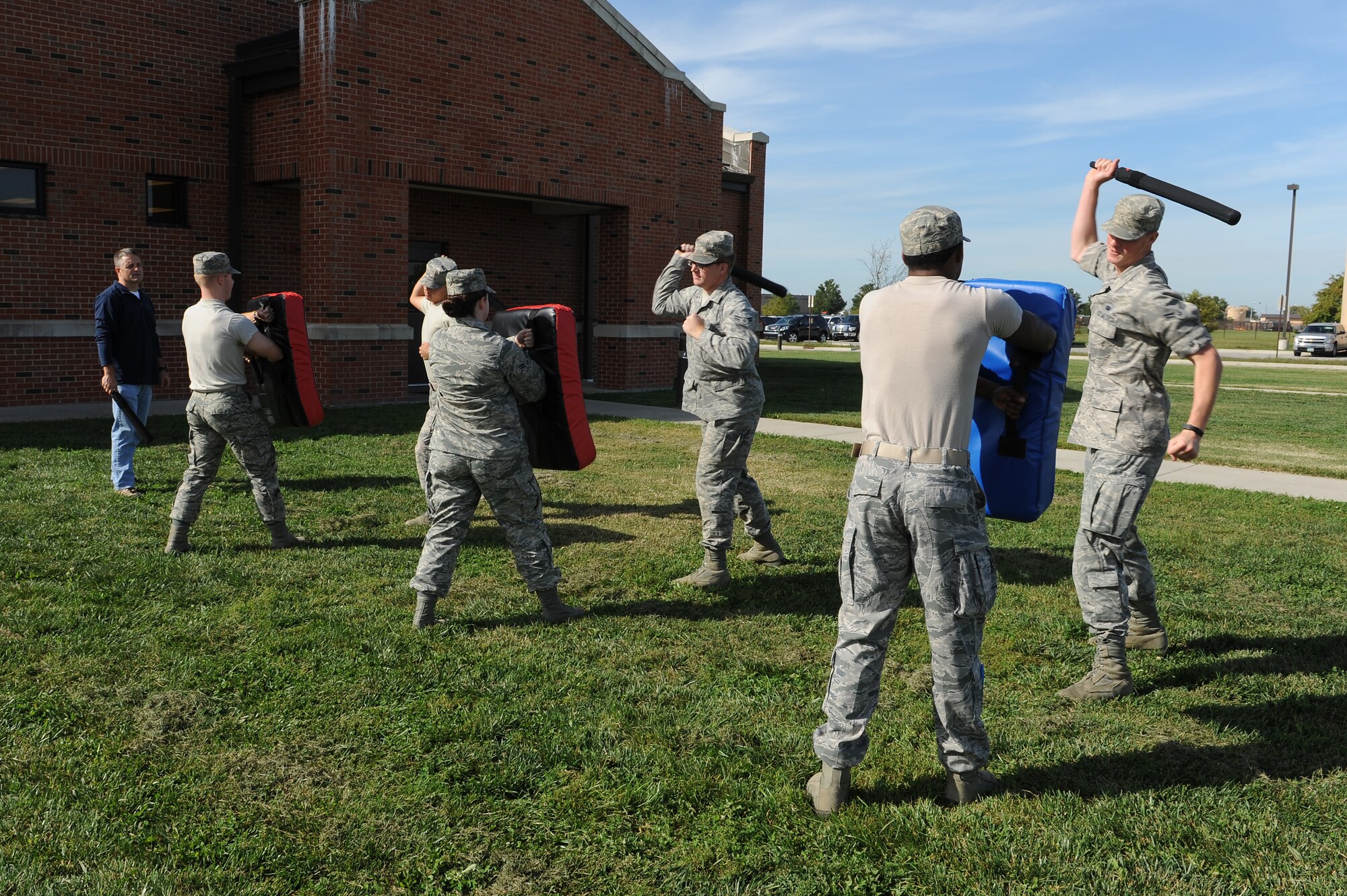 Augmentees for the 375th Security Forces Squadron learn how to properly strike with their batons Sept. 24, 2014 at Scott Air Force Base, Ill. Augmentees are partnered with SF members and assist them with making arrests, performing gate guard and other duties. (U.S. Air Force photo/Staff Sgt. Jonathan Fowler)