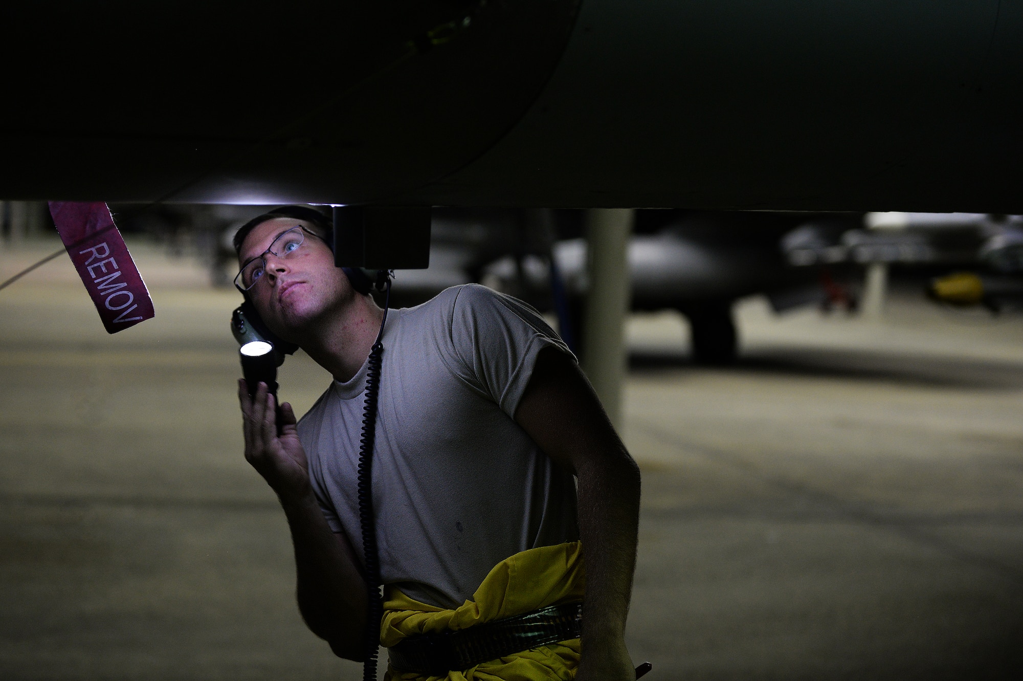 U.S. Air Force Staff Sgt. Stephen Leonardi, 20th Aircraft Maintenance Squadron crew chief, inspects an F-16CM Fighting Falcon after a flight at Shaw Air Force Base, S.C., Sept. 17, 2014. Crew chiefs perform post-flight inspections to ensure there are no missing pieces or damages to the aircraft that may have occurred during flight. (U.S. Air Force photo by Airman 1st Class Michael Cossaboom/Released)