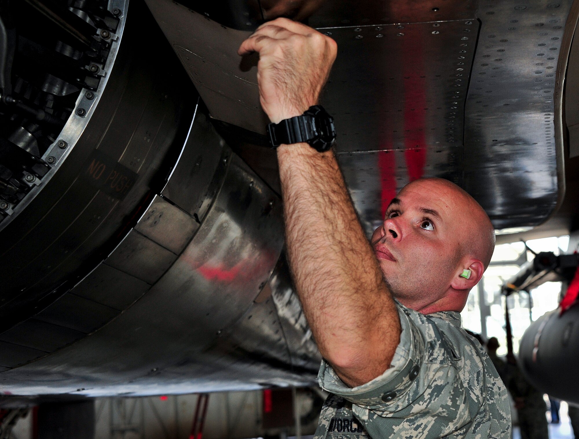 Tech. Sgt. Rusty Jones inspects the engine exhaust section of an F-15 Eagle Sept. 26 following 96th Maintenance Group competition events at Eglin Air Force Base, Fla. Quality assurance personnel like Jones participate with every weapons load and dedicated crew chief competitions as inspectors. They inspect the aircraft, boxes, aircraft forms and look for discrepancies. The chief inspector will brief the chiefs and senior leadership within maintenance units of their findings, if any, and tally up the scores to determine the winners. (U.S. Air Force Photo/Ilka Cole)