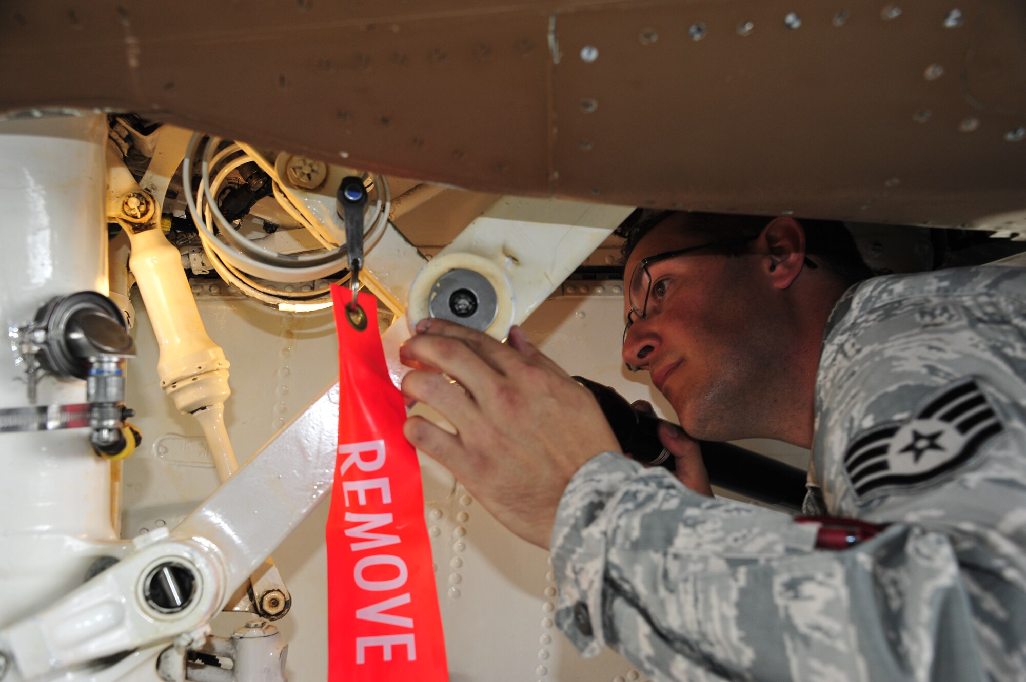 Staff Sgt. Matthew Murphy, inspects the right main landing gear wheel well of an F-15 Eagle Sept. 26 following 96th Maintenance Group competition events at Eglin Air Force Base, Fla. Quality assurance personnel like Murphy participate with every weapons load and dedicated crew chief competitions as inspectors. They inspect the aircraft, boxes, aircraft forms and look for discrepancies. The chief inspector will brief the chiefs and senior leadership within maintenance units of their findings, if any, and tally up the scores to determine the winners. (U.S. Air Force Photo/Ilka Cole)